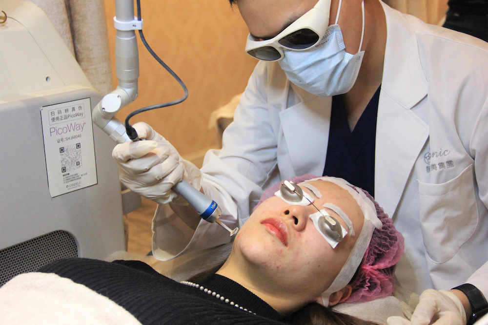 This photo taken on November 11, 2021 shows Kayla Zhang, a finance worker, receiving laser facial treatment at a beauty clinic in Shanghai. u00e2u20acu201d AFP pic