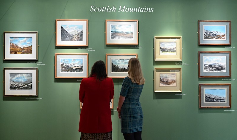 Gallery workers look at watercolour paintings by Britain's Prince Charles, Prince of Wales at an exhibition entitled 'HRH The Prince of Wales's Watercolours' at the Garrison Chapel in London January 12, 2022. u00e2u20acu201d AFP pic