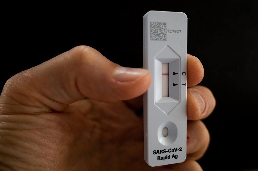A generic image of person holding up a SARS CoV-2 Rapid Antigen Test showing a negative test result in Canberra November 2, 2021. u00e2u20acu201d AAP Images via Reuters