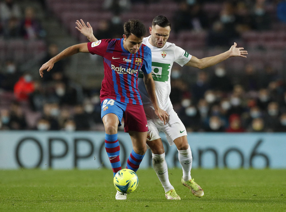 FC Barcelona's Eric Garcia in action with Elche's Lucas Perez Soccer Football at Camp Nou, Barcelona, Spain December 18, 2021. u00e2u20acu201d Reuters pic