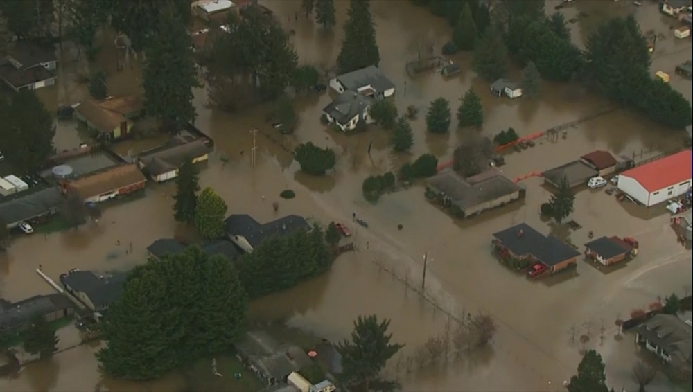Buildings are inundated with floodwaters due to heavy rain in Lewis County, Washington January 7, 2022 in this image taken from a televison footage. u00e2u20acu201d Picture by KATU via Reuters