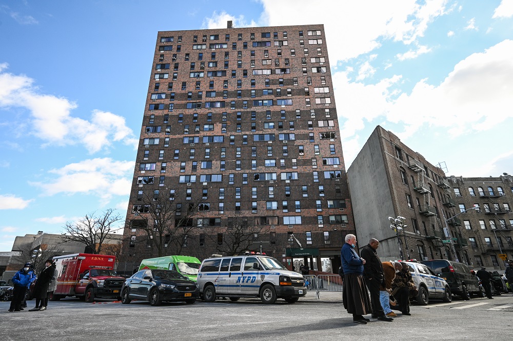 People participate in an interfaith vigil outside the Twin Parks North West residential apartment building after a fire that left at least 19 people dead, including nine children, in the Bronx, New York January 10, 2022. u00e2u20acu201d Picture by Anthony Behar/Sipa 
