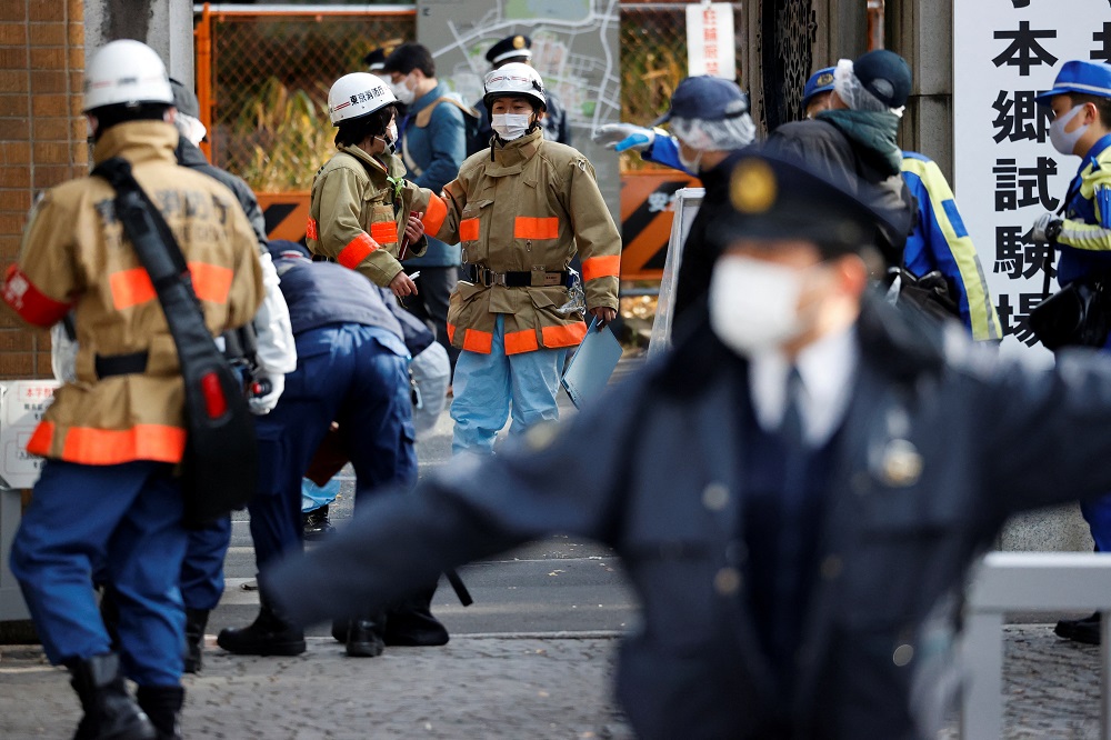 Emergency personnel are seen at the site where a stabbing incident happened at an entrance gate of Tokyo University in Tokyo January 15, 2022. u00e2u20acu201d Reuters pic