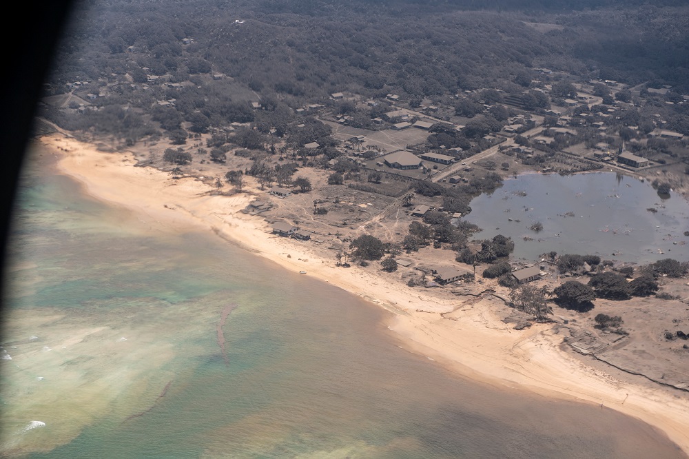 A view through the window of a New Zealand Defence Force P-3K2 Orion surveillance flight shows heavy ash fall over Nomuka in Tonga January 17, 2022. u00e2u20acu201d Picture by New Zealand Defence Force/Handout via Reuters 