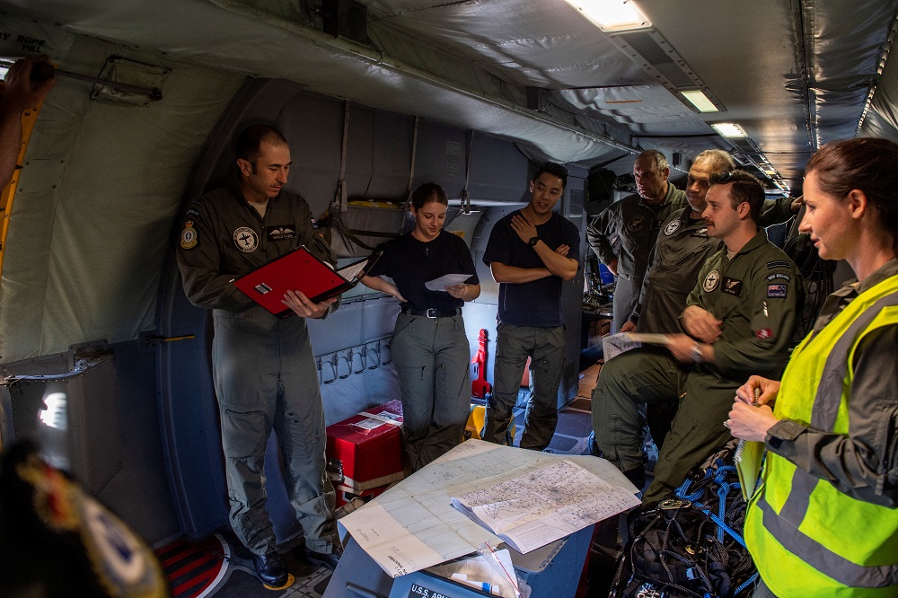 Captain Squadron Leader Marcus Hogan gives a briefing to the aircrew on board a Royal New Zealand Air Force P-3K2 Orion aircraft during a surveillance flight over an area in Tonga January 17, 2022. u00e2u20acu201d Picture by New Zealand Defence Force/Handout via Reut