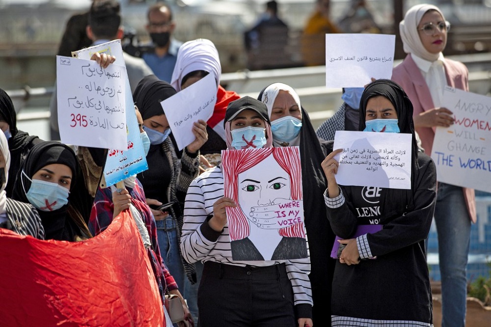 In this file photo taken on March 8, 2021, demonstrators wearing cross-out masks attend a rally for International Women's Day in Iraq's southern city of Basra. u00e2u20acu201d AFP pic