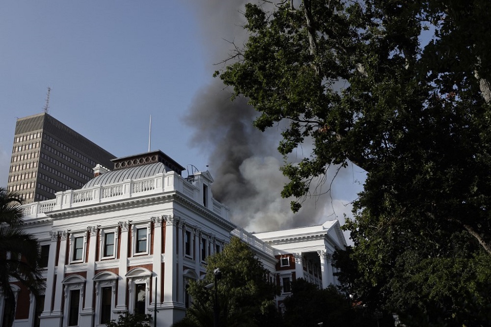Smoke billows from the roof of a building at the South African Parliament precinct in Cape Town on January 2, 2022, during a fire incident. u00e2u20acu201d AFP pic