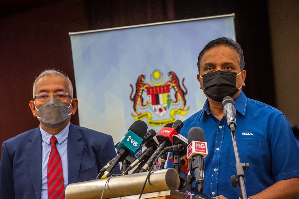 Rural Development Minister Datuk Seri Mahdzir Khalid (left) and Minister of Housing and Local Government Datuk Seri Reezal Merican at a press conference in Putrajaya January 10, 2022. u00e2u20acu201d Picture by Shafwan Zaidon
