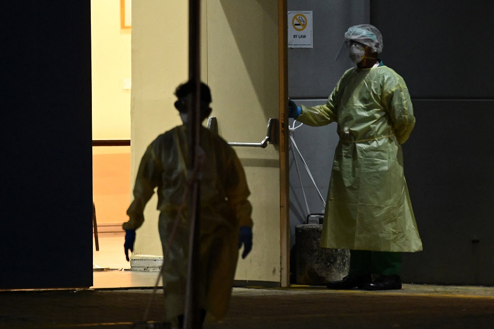 Medical personnel waiting for Covid-19 patients to be transferred to a hospital. u00e2u20acu201d AFP pic