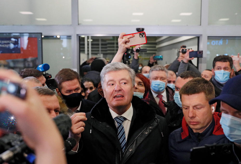 Ukrainian former President Petro Poroshenko speaks to journalists upon arrival at Zhulyany airport in Kyiv, Ukraine January 17, 2022. u00e2u20acu201d Reuters pic