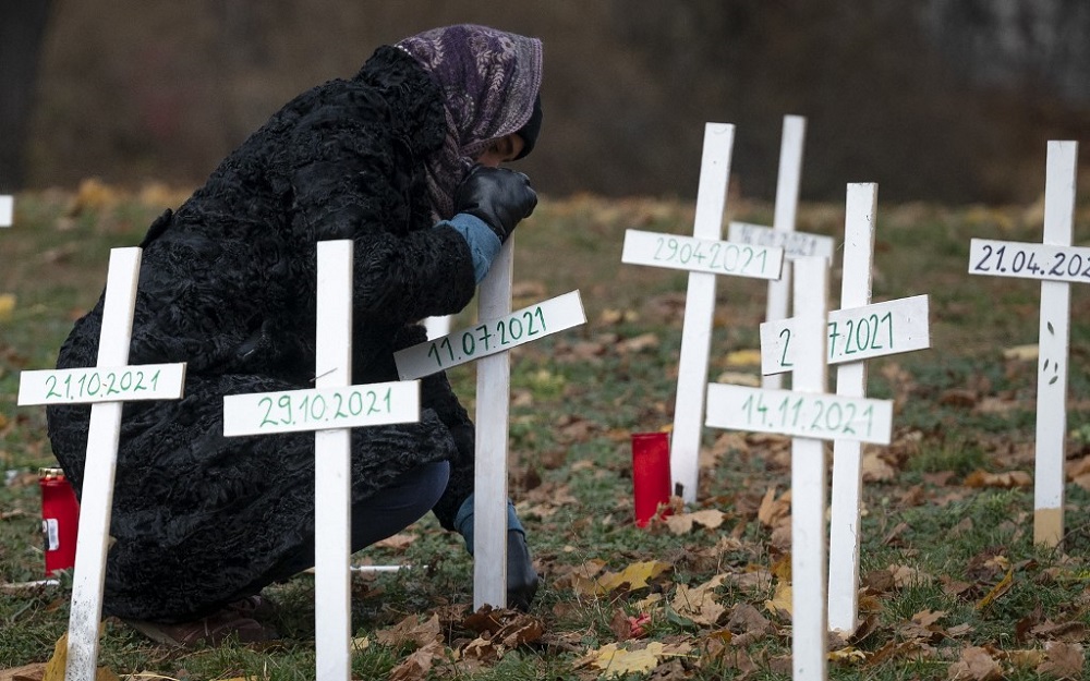 A woman places a symbolic cross in tribute to women killed in Austria in 2021, at Auer-Welschbach Park in Vienna, Austria November 30, 2021. u00e2u20acu201d AFP Pic