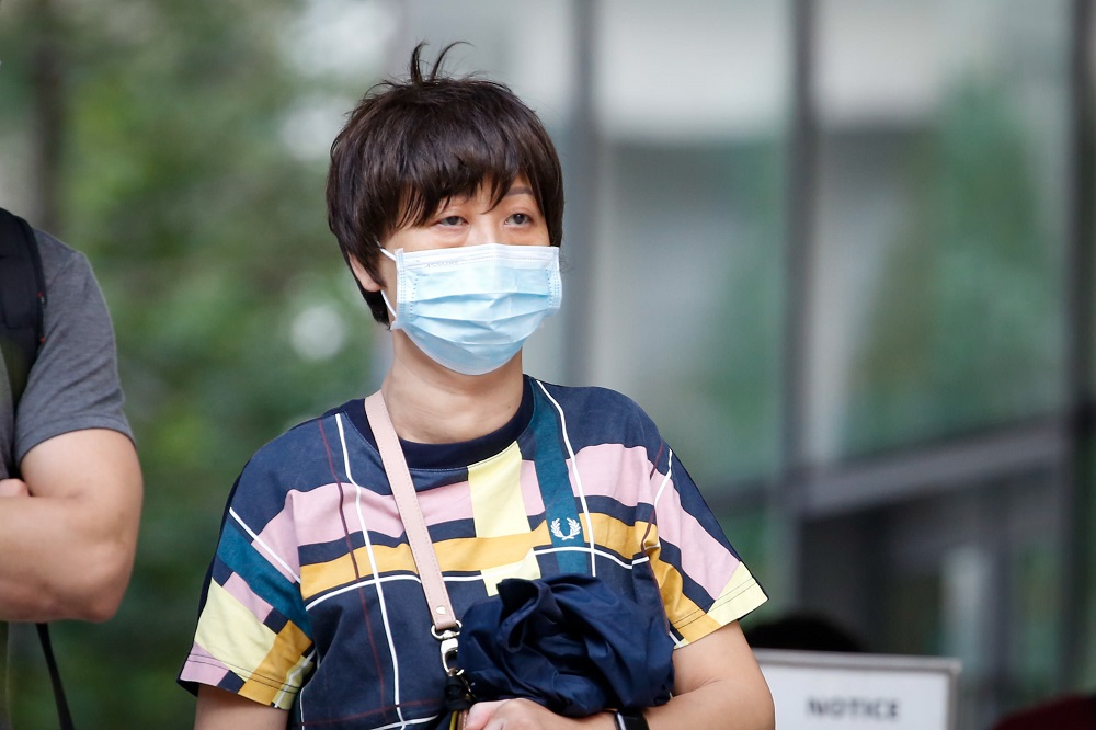 Wang Xuyi leaving the State Courts in Singapore January 18, 2022. u00e2u20acu201d TODAY pic