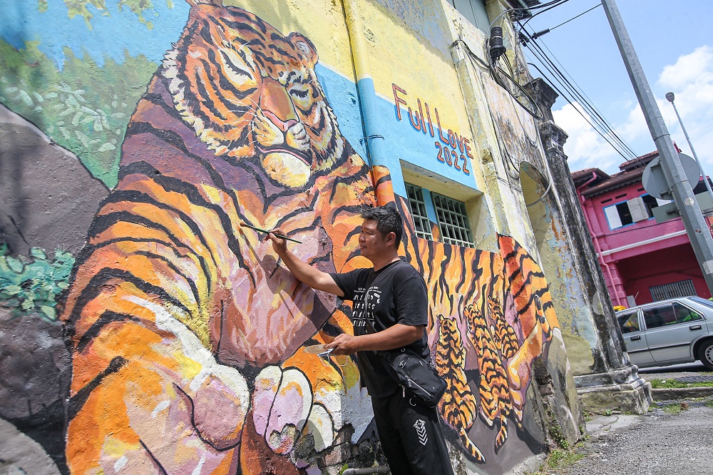 A roaring start to the Chinese new year with Lai’s start to mural refurbishment works. — Picture by Farhan Najib 