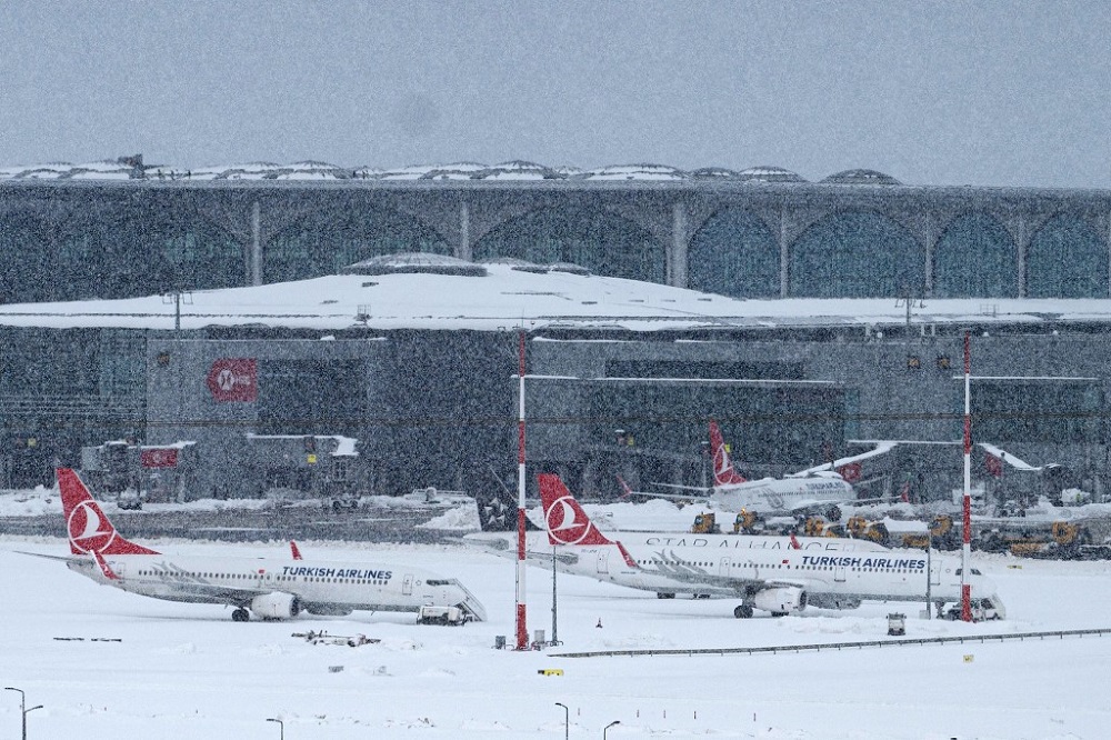 Aircrafts are parked on the tarmac of Istanbul airport, where flights are cancelled due to blizzard and heavy snowfall, in Istanbul January 25, 2022. u00e2u20acu201d AFP pic