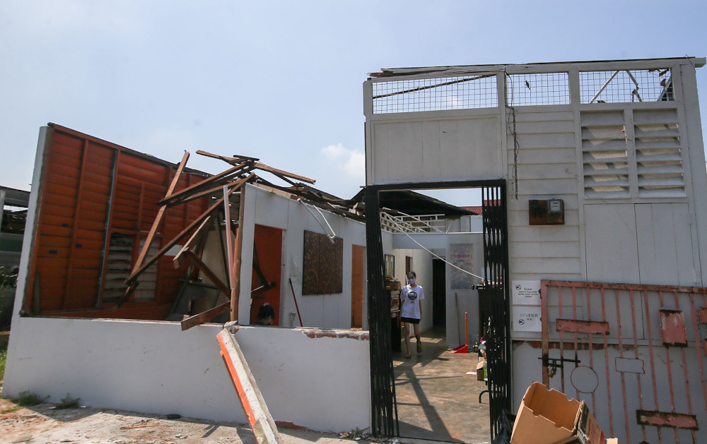 Several houses at Kampung Tawas, Ipoh were damaged or destroyed following strong winds in the area yesterday. Picture taken January 31, 2022. — Picture by Farhan Najib