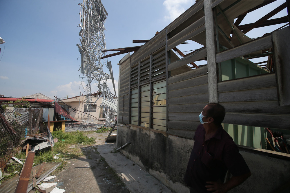 Several houses at Kampung Tawas, Ipoh were damaged or destroyed following strong winds in the area yesterday. Picture taken January 31, 2022. — Picture by Farhan Najib