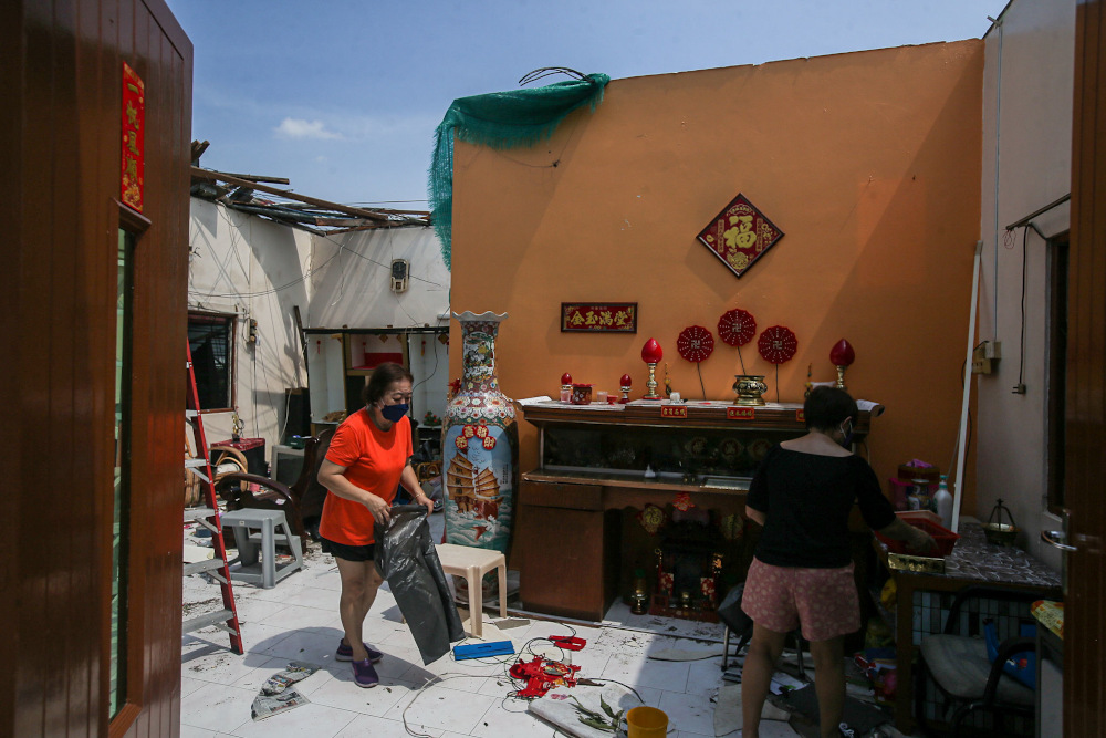 Several houses at Kampung Tawas, Ipoh were damaged or destroyed following strong winds in the area yesterday. Picture taken January 31, 2022. — Picture by Farhan Najib