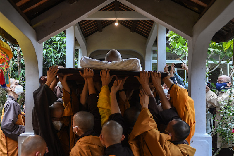 Buddhist monks carry the body of Vietnamese monk Thich Nhat Hanh, 95, during his funeral ceremony at the Tu Hieu Pagoda in Hue January 23, 2022. u00e2u20acu201d AFP pic