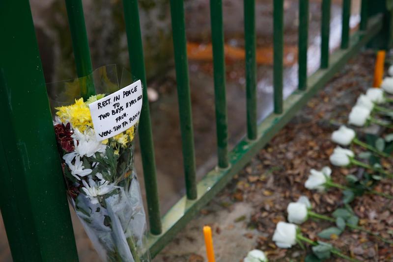 A handwritten note lay next to offerings of flowers and food at the site where the bodies of the two 11-year-old boys were discovered. u00e2u20acu201d TODAY pic