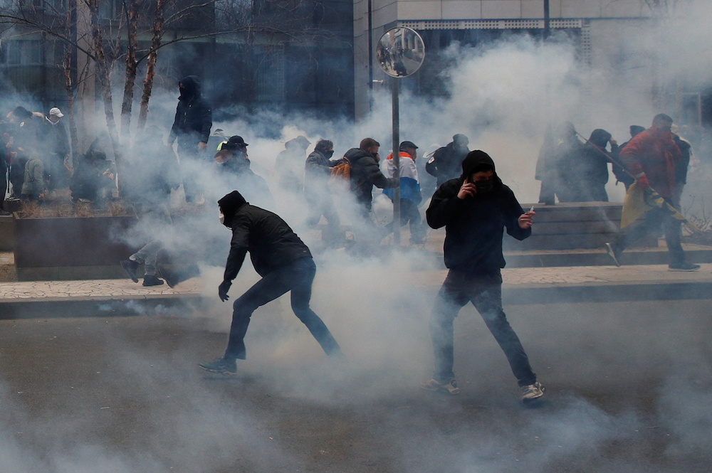 Protesters react during clashes at a demonstration against the Belgian government's restrictions imposed to contain the spread of Covie-19 in Brussels, Belgium January 23, 2022. u00e2u20acu201d Reuters pic