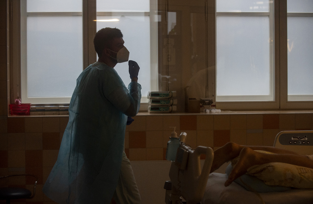 A medical staff treats a patient infected with Covid-19 in an intensive care unit (ICU) in the General University Hospital in Prague January 26, 2022. u00e2u20acu201d AFP pic