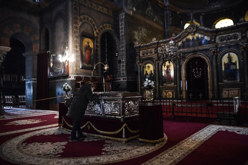 A Greek Orthodox Christian believer prays inside a church in Thessaloniki, northern Greece January 23, 2022. u00e2u20acu201d AFP pic