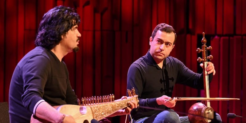 Afghan-born musician Homayoun Sakhi (left) plays the rubab with Adib Rostami) playing the kamancheh during a sound check at the Barbican ahead of u00e2u20acu02dcSongs of Hopeu00e2u20acu2122 benefit concert for Afghanistan in London. u00e2u20acu201d AFP pic
