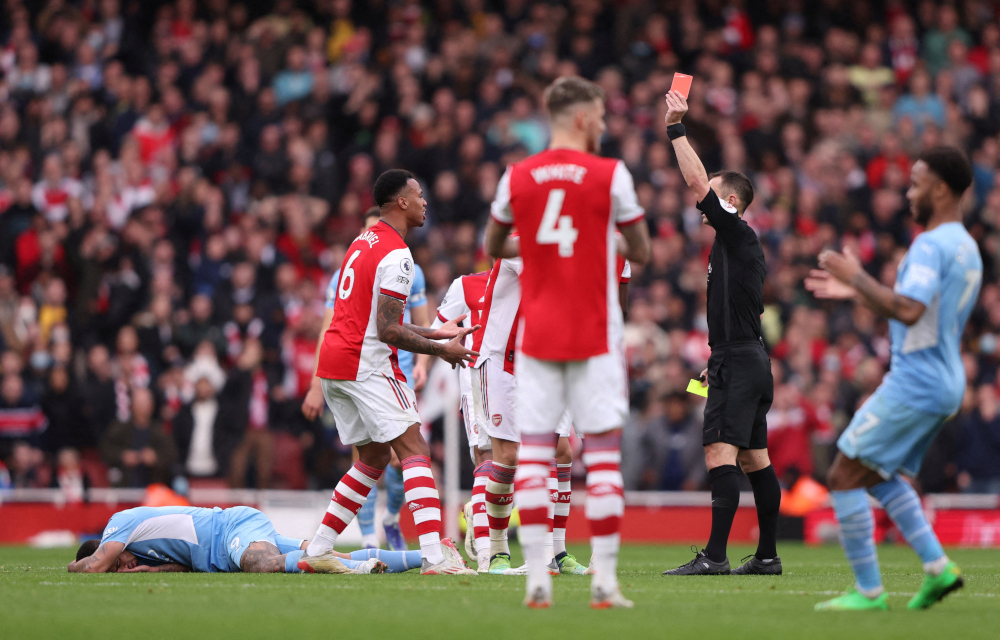 Arsenalu00e2u20acu2122s Gabriel is shown a red card by referee Stuart Attwell during the match with Manchester City at Emirates Stadium, London, January 1, 2022. u00e2u20acu201d Reuters pic 