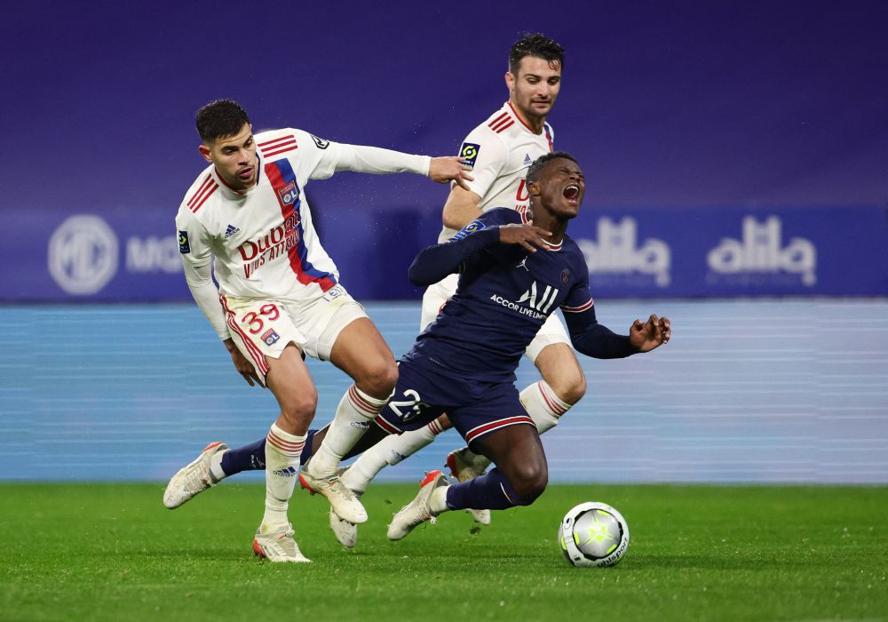 Olympique Lyonnais' Bruno Guimaraes (left) in action with Paris St Germain's Nuno Mendes at the Groupama Stadium, Lyon January 9, 2022. u00e2u20acu201d Reuters pic