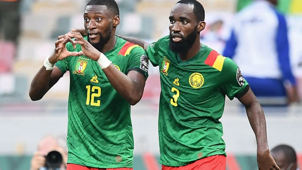 Karl Toko Ekambi (left) celebrates with Moumi Ngamaleu after scoring the first of his two goals in Cameroonu00e2u20acu2122s win over Gambia in Douala. u00e2u20acu201d AFP pic