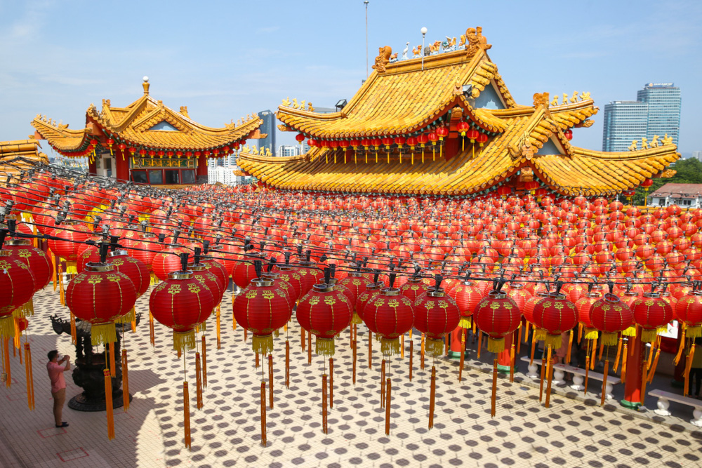 A worshipper wears a protective mask while praying at the Thean Hou Temple in Kuala Lumpur, January 19, 2022. — Picture by Yusof Mat Isa