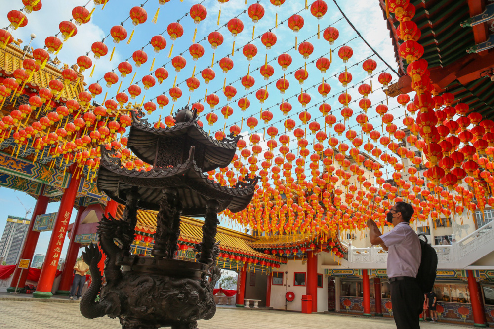 A worshipper wears a protective mask while praying at the Thean Hou Temple in Kuala Lumpur, January 19, 2022. u00e2u20acu201d Picture by Yusof Mat Isa