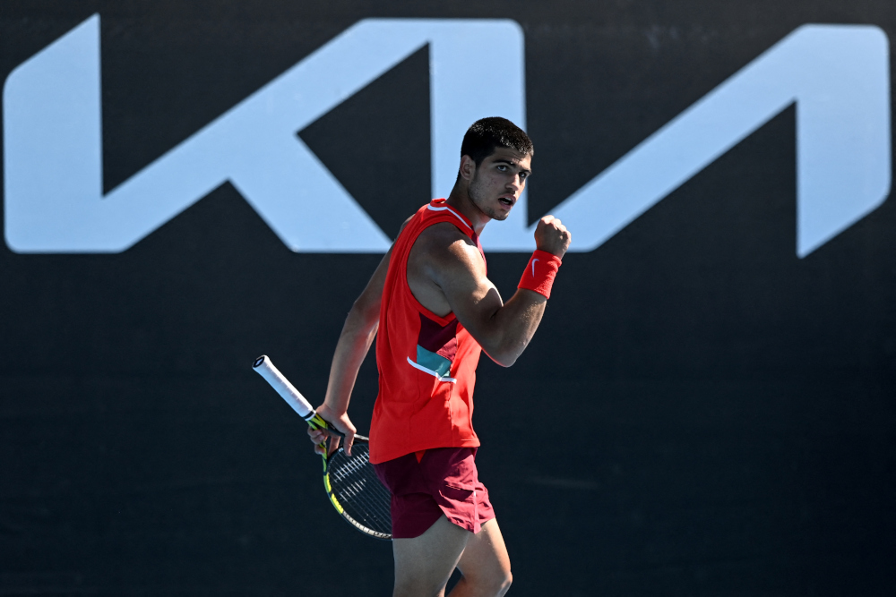 Spainu00e2u20acu2122s Carlos Alcaraz reacts after a point against Serbiau00e2u20acu2122s Dusan Lajovic during their menu00e2u20acu2122s singles match on day three of the Australian Open tennis tournament in Melbourne, January 19, 2022. u00e2u20acu201d AFP picnn