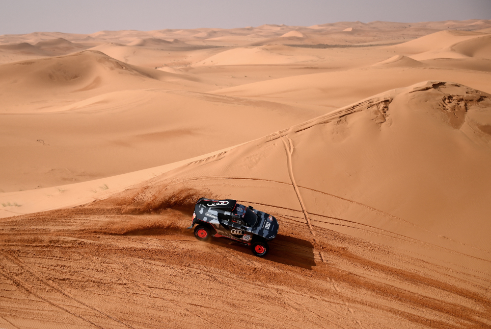 Audiu00e2u20acu2122s electric Spanish driver Carlos Sainz of Spain and co-driver Lucas Cruz of Spain compete during Stage 3 of the Dakar Rally 2022 between the Saudi areas of al-Artawiya and al-Qaysumah, January 4, 2022. u00e2u20acu201d AFP picnn