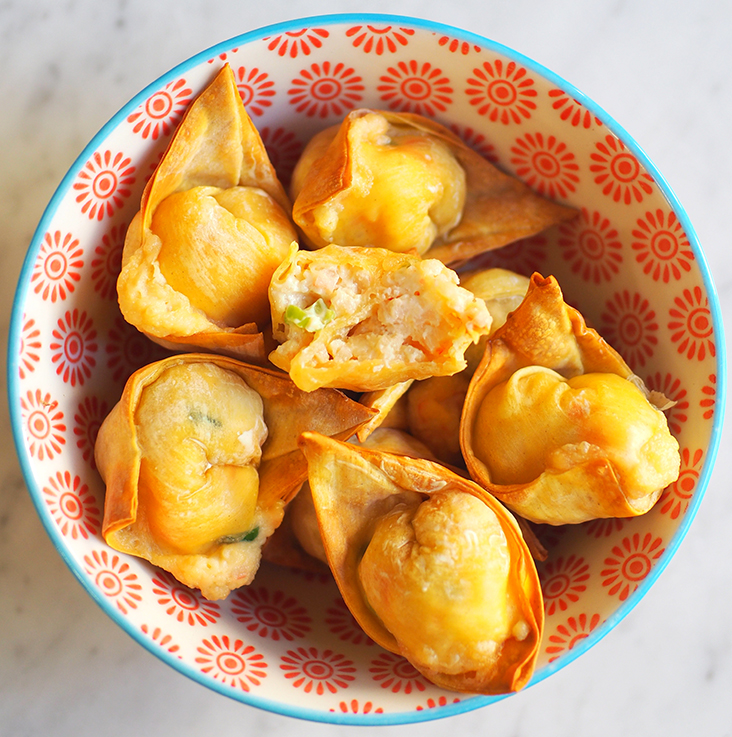 Each morsel has a filling of crab meat, surimi, cream cheese and chopped spring onions.