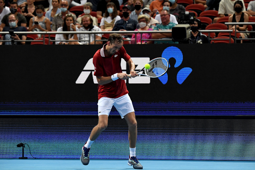 Daniil Medvedev of Russia hits a return against Australiau00e2u20acu2122s Alex de Minaur during their menu00e2u20acu2122s singles tennis match at the 2022 ATP Cup in Sydney, January 4, 2022. u00e2u20acu201d AFP picnn