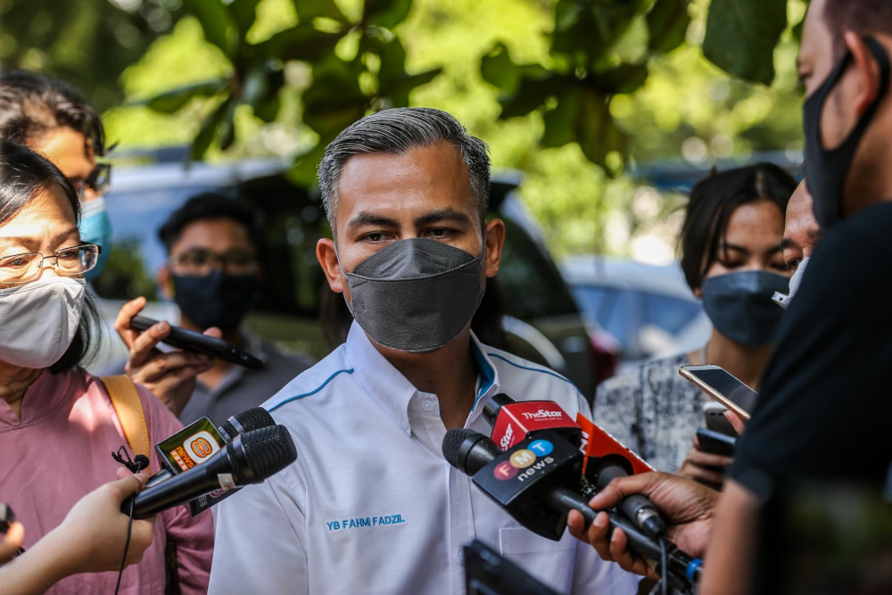 Lembah Pantai MP Fahmi Fadzil speaks to reporters outside the Dang Wangi district police headquarters in Kuala Lumpur January 7, 2022. u00e2u20acu201d Picture by Hari Anggara