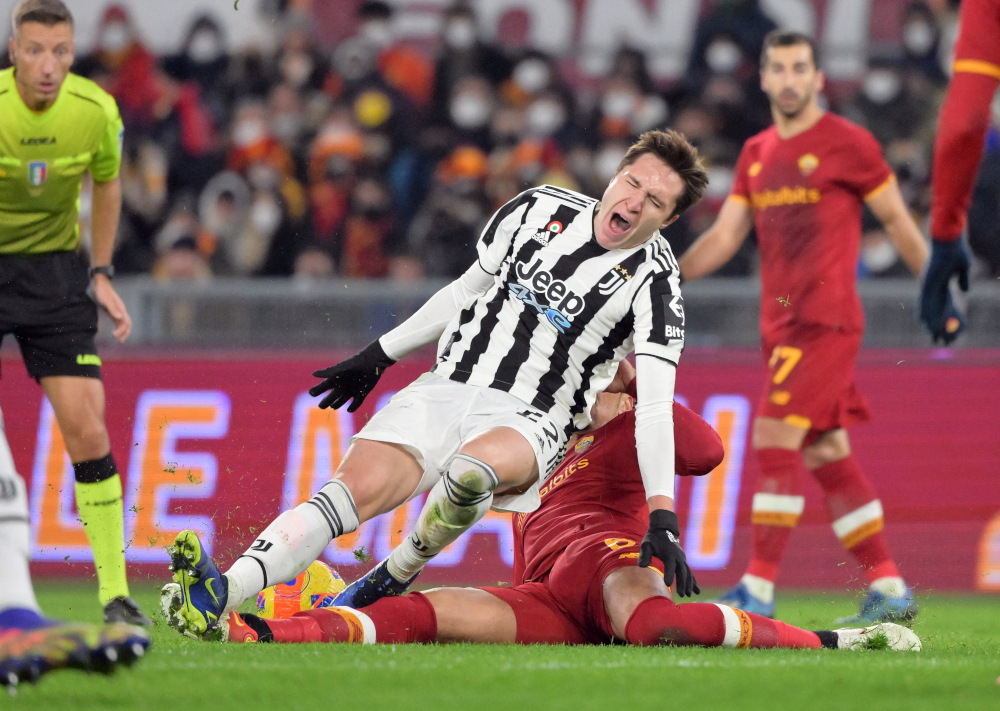 Juventusu00e2u20acu2122 Federico Chiesa in action with AS Romau00e2u20acu2122s Chris Smalling at Stadio Olimpico, Rome, Italy, January 9, 2022. Chiesa will require surgery on a torn ligament injury picked up in his sideu00e2u20acu2122s win over AS Roma. u00e2u20acu201d Reuters pic  