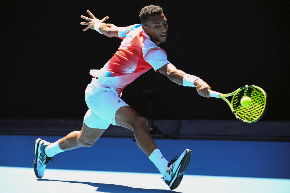 Canadau00e2u20acu2122s Felix Auger-Aliassime hits a return against Croatiau00e2u20acu2122s Marin Cilic during their menu00e2u20acu2122s singles match on day eight of the Australian Open tennis tournament in Melbourne, January 24, 2022. u00e2u20acu201d AFP pic 