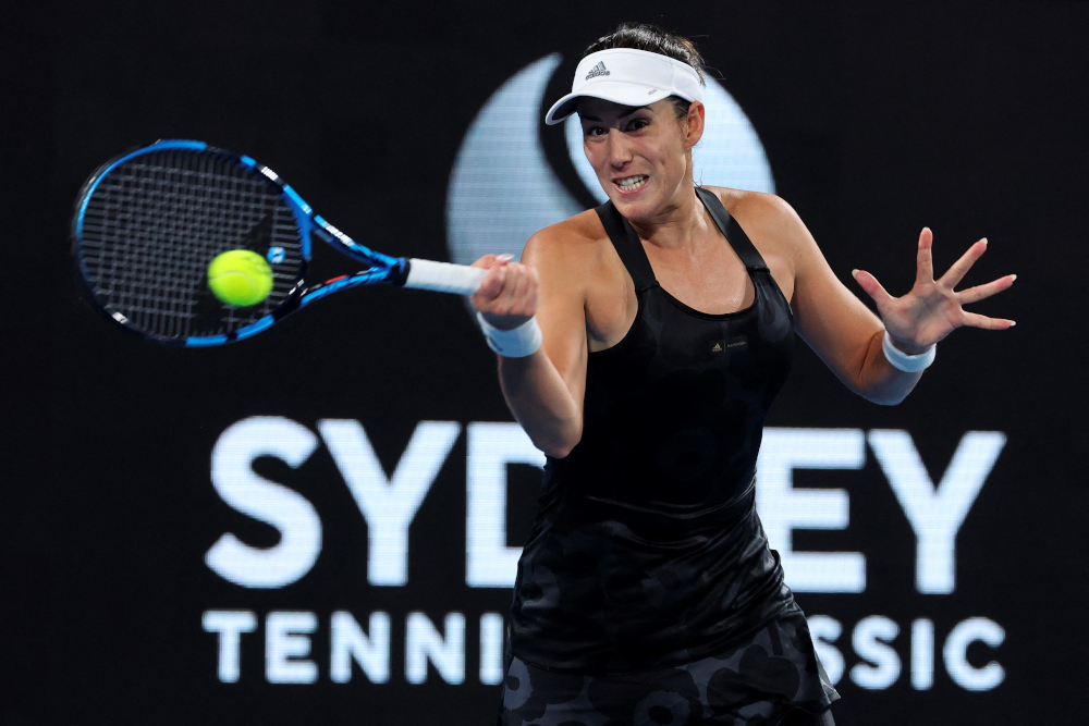 Garbine Muguruza of Spain hits a return against Daria Kasatkina of Russia during their women's singles quarter-final match at the Sydney Classic tennis tournament in Sydney, January 13, 2022. u00e2u20acu201d AFP 