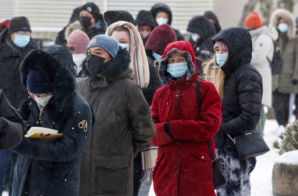 People queue to collect Covid-19 antigen test kits at the Rideau Centre mall in Ottawa, Ontario, Canada January 7, 2022. u00e2u20acu2022 Reuters file pic