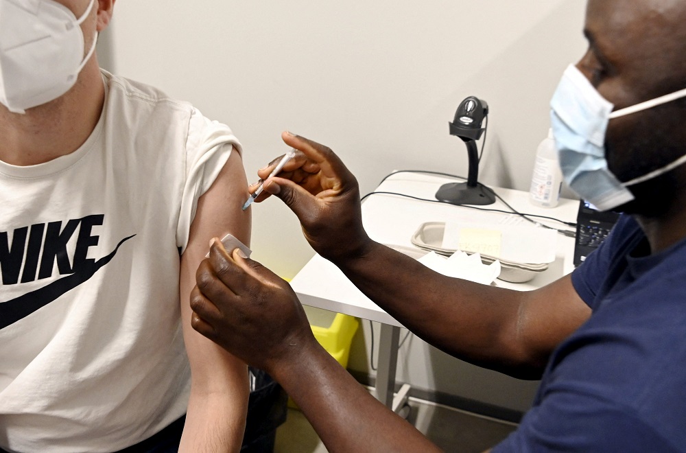 A man receives a booster dose of the Covid-19 vaccine at the vaccine centre in Espoo, Finland January 4, 2022. u00e2u20acu2022 Reuters pic