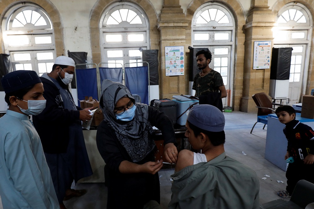 A healthcare worker administers a dose of Covid-19 vaccine at a vaccination centre in Karachi, Pakistan January 16, 2022. u00e2u20acu2022 Reuters pic