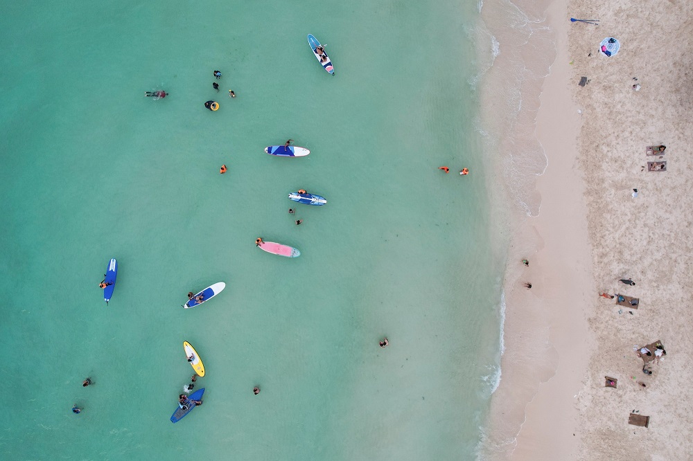 People relax along White Beach amid the Covid-19 outbreak, in Boracay Island, Aklan province, Philippines December 1, 2021. u00e2u20acu2022 Reuters file pic