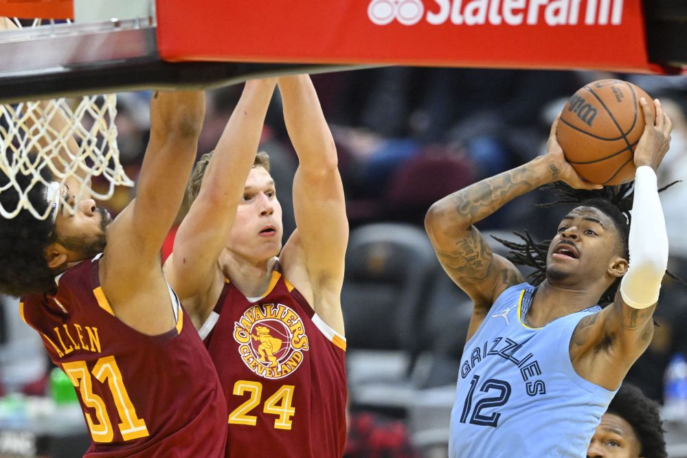 Memphis Grizzlies guard Ja Morant (12) drives to the basket beside Cleveland Cavaliers forward Lauri Markkanen (24) and centre Jarrett Allen (31) at the Rocket Mortgage FieldHouse in Cleveland January 4, 2022. u00e2u20acu201d Reuters pic