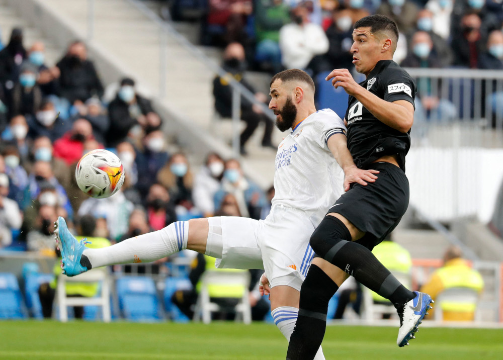 Real Madridu00e2u20acu2122s Karim Benzema in action with Elcheu00e2u20acu2122s Diego Gonzalez at Santiago Bernabeu, Madrid, Spain, January 23, 2022. u00e2u20acu201d Reuters pic 