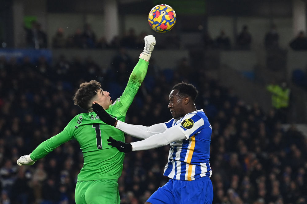 Chelseau00e2u20acu2122s Spanish goalkeeper Kepa Arrizabalaga punches the ball under pressure from Brightonu00e2u20acu2122s English striker Danny Welbeck during the EPL match at the American Express Community Stadium in Brighton, England, January 18, 2022. u00e2u20acu201d AFP pic 