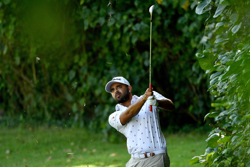Khalin Joshi of India playing a shot during round one of the Singapore International golf tournament in Singapore, January 13, 2022. u00e2u20acu201d Paul Lakatos/Asian Tour handout pic via AFP