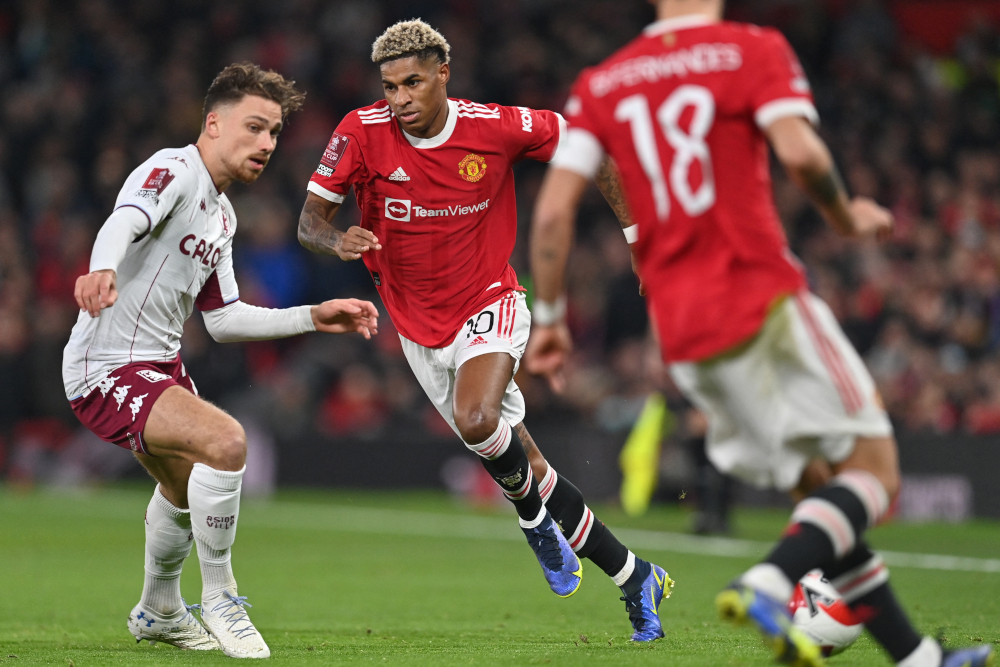 Manchester United striker Marcus Rashford runs past Aston Villa defender Matty Cash during the English FA Cup third round match at Old Trafford in Manchester, north-west England, January 10, 2022. u00e2u20acu201d AFP pic 
