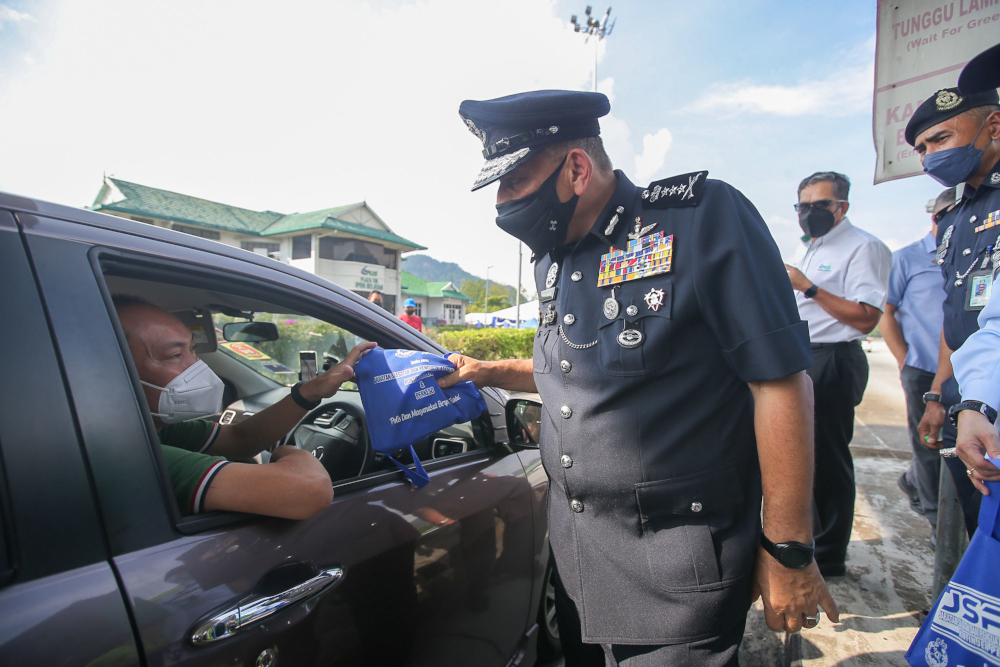 Perak police chief Datuk Mior Faridalathrash Wahid launches the 17th Op Selamat in conjunction with the Chinese New Year festival at the north-bound Plaza Toll Ipoh-South, January 28, 2022. u00e2u20acu201d Picture by Farhan Najib 